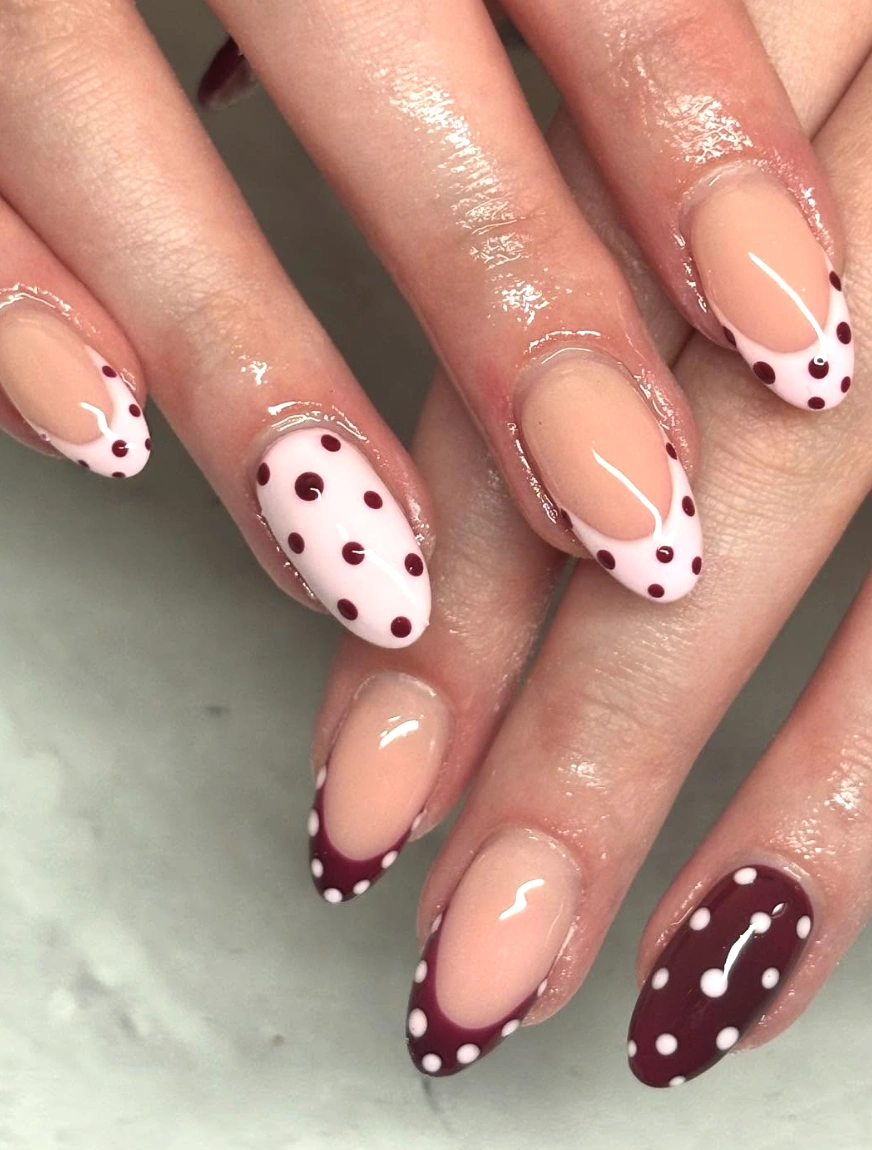 Almond Nails with Burgundy Polka Dots and French Tip Accents