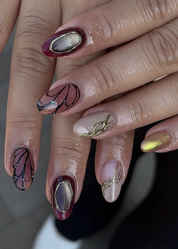 Almond Nails with Butterfly Accents and Gold Foil Details