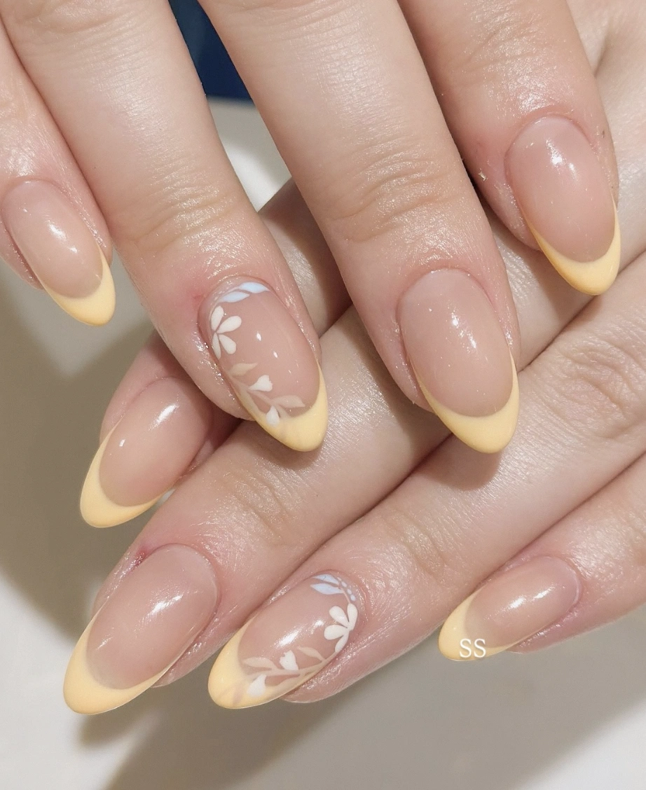 Almond Nails with Buttery Yellow Tips and Floral Detail