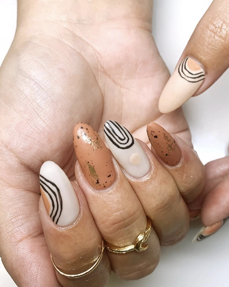 Almond Nails with Earth Tone Abstracts and Gold Flakes