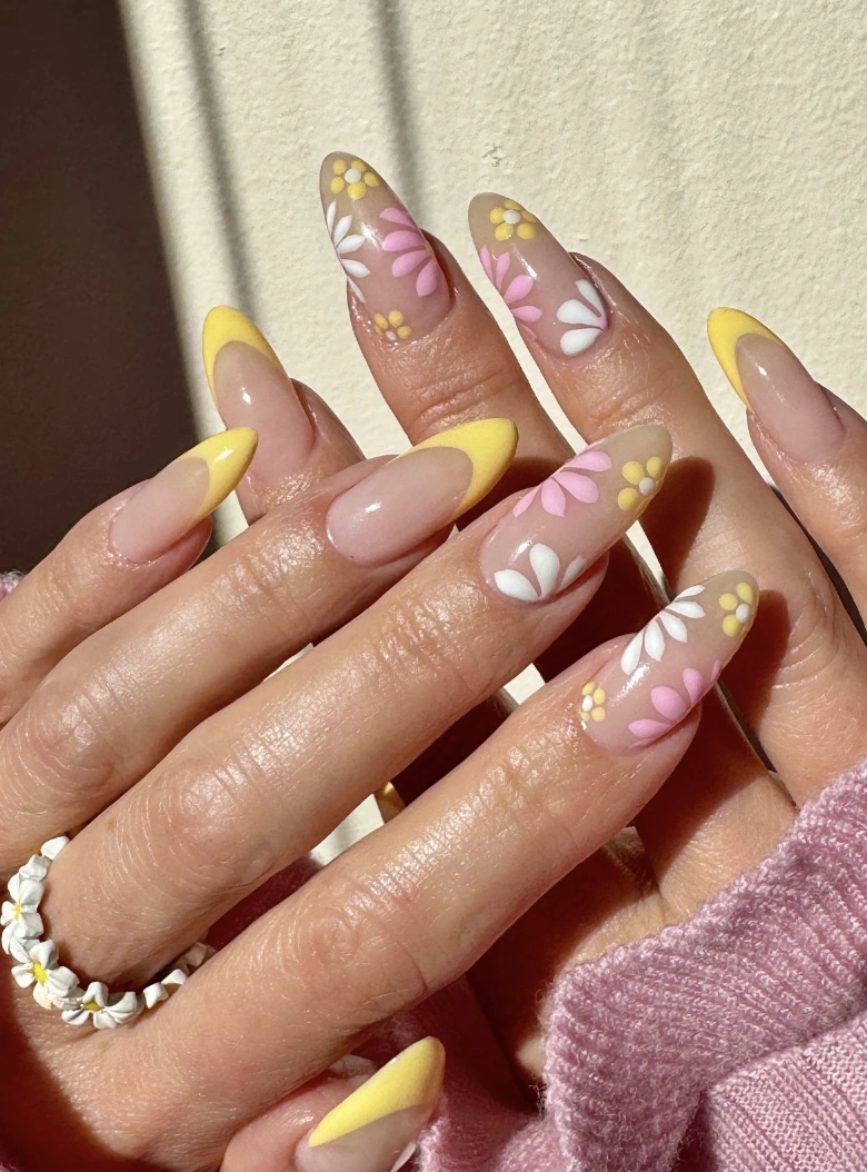 Almond Nails with Yellow French Tips and Delicate Flower Design