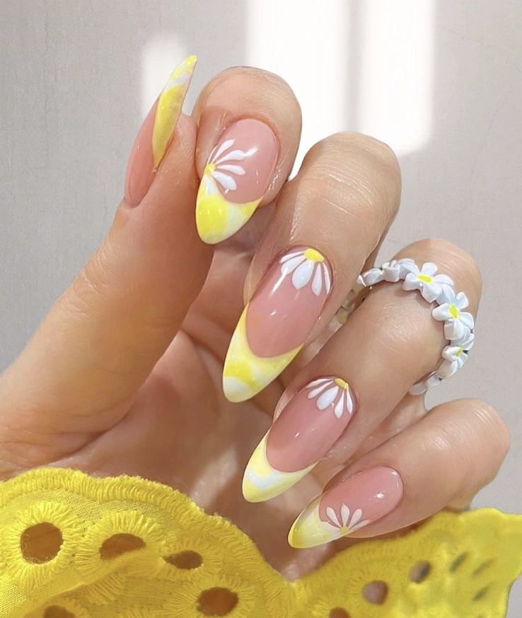 Almond Nails with Yellow Ombre and Daisy Accents