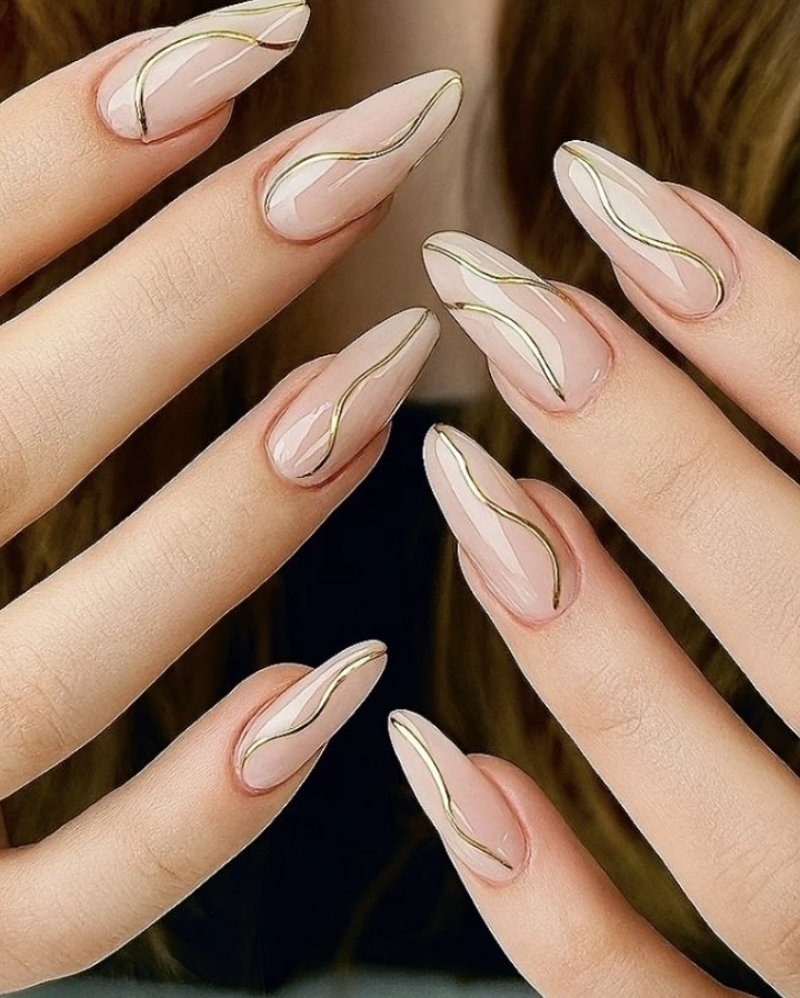 Almond Nude Nails with Flowing Gold Detail