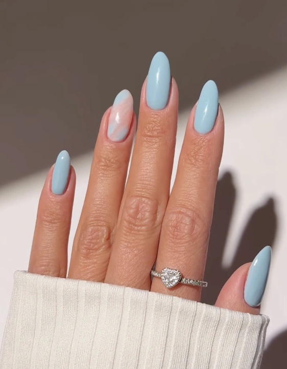 Almond-Shaped Baby Blue Nails with Marble Accent