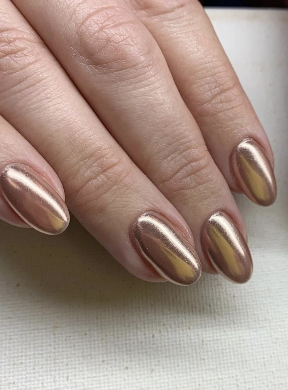 Almond-Shaped Chrome Nails for Fall in Warm Rose Gold with a Glossy Finish