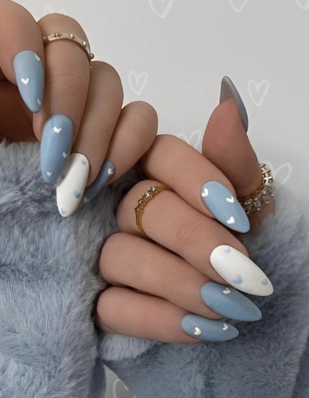 Almond-Shaped Light Blue Nails with White Heart Details