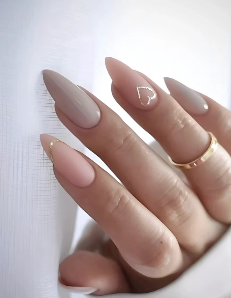 Almond-Shaped Taupe and Pink Nude Nails with Delicate Gold Accents