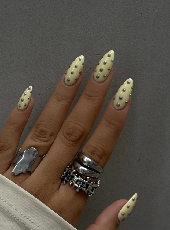 Almond Yellow Nails with Silver Stud Accents