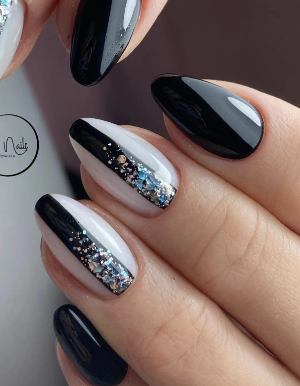 Asymmetrical Black and White Nails with Glitter Accent