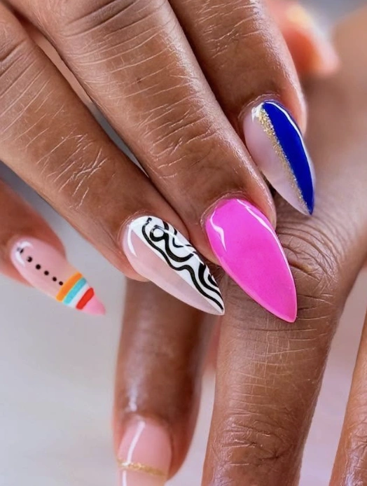 Asymmetrical Stiletto Nails with Bold Colors and Graphic Details