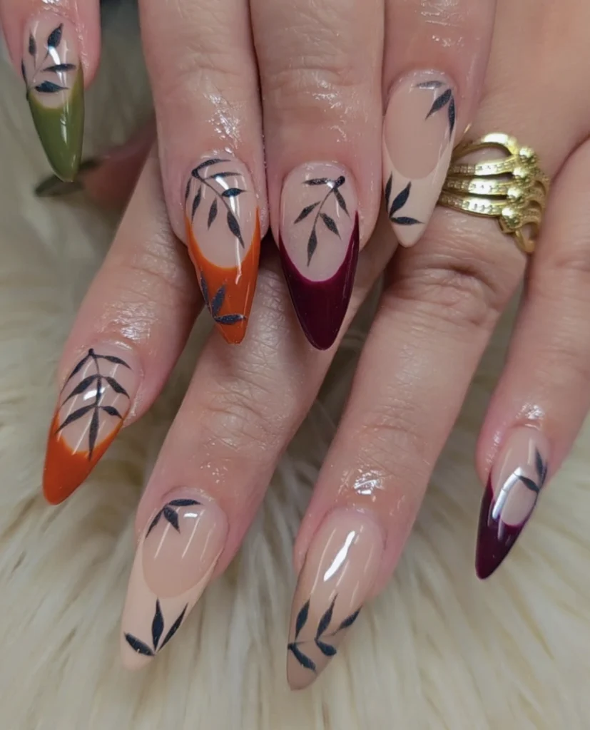 Autumn-Inspired Stiletto Nails with Earthy Tones and Elegant Leaf Designs