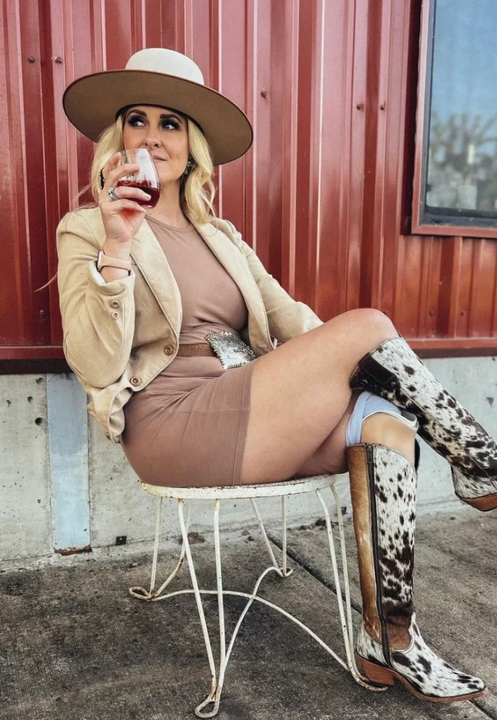 Beige Blazer + Taupe Bodycon Dress + Tan Wide-Brim Hat + Cow Print Knee-High Boots