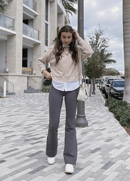 Beige Cropped Sweatshirt + White Button-Up Shirt + Grey Flared Leggings + White Sneakers