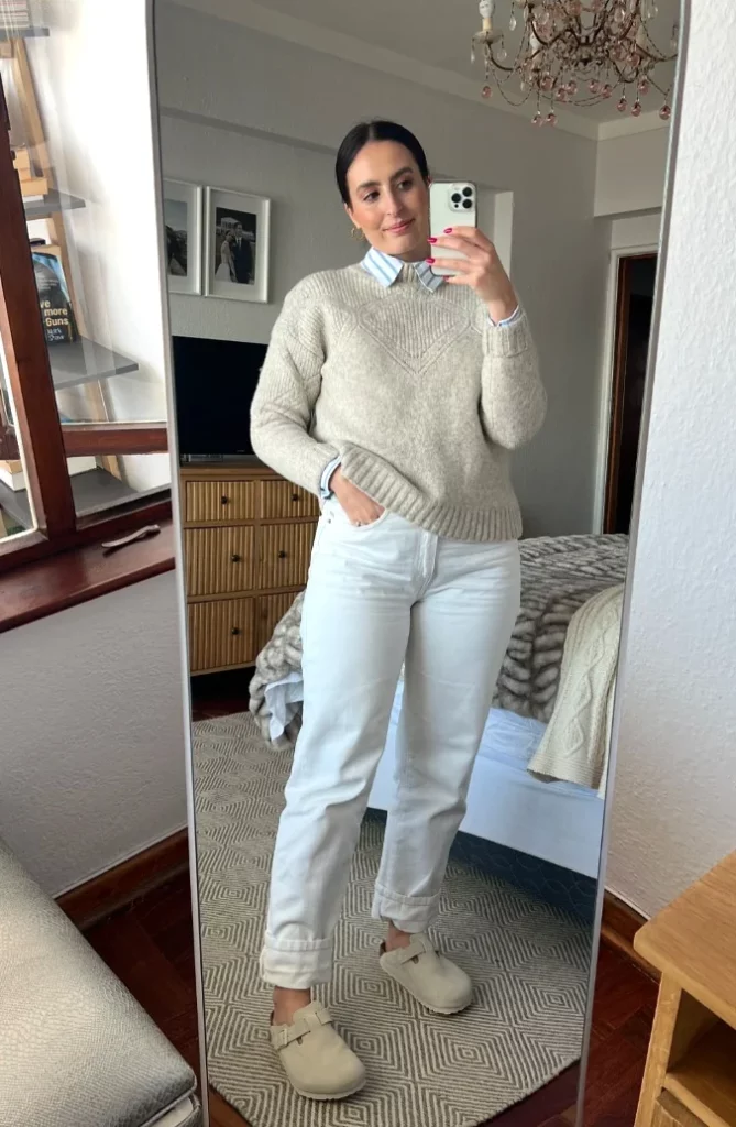 Beige Knit Sweater + Blue White Striped Collared Shirt + White Straight-Leg Jeans + Beige Slip-On Mules