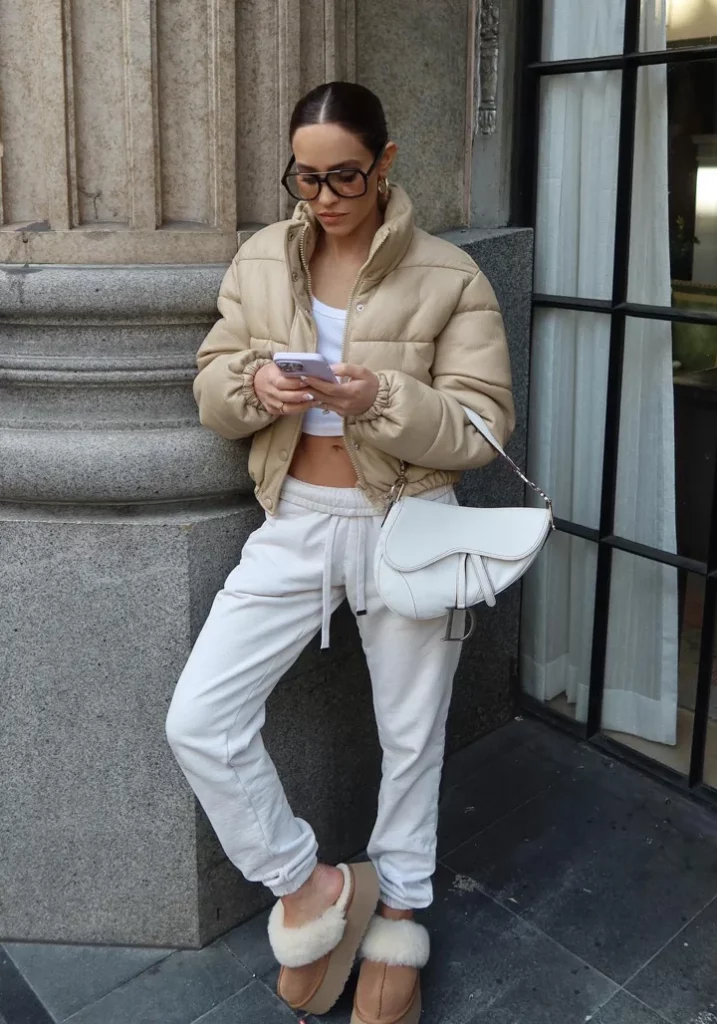 Beige Puffer Jacket + White Cropped Tank Top + White Jogger Sweatpants + Tan Shearling Slide Sandals
