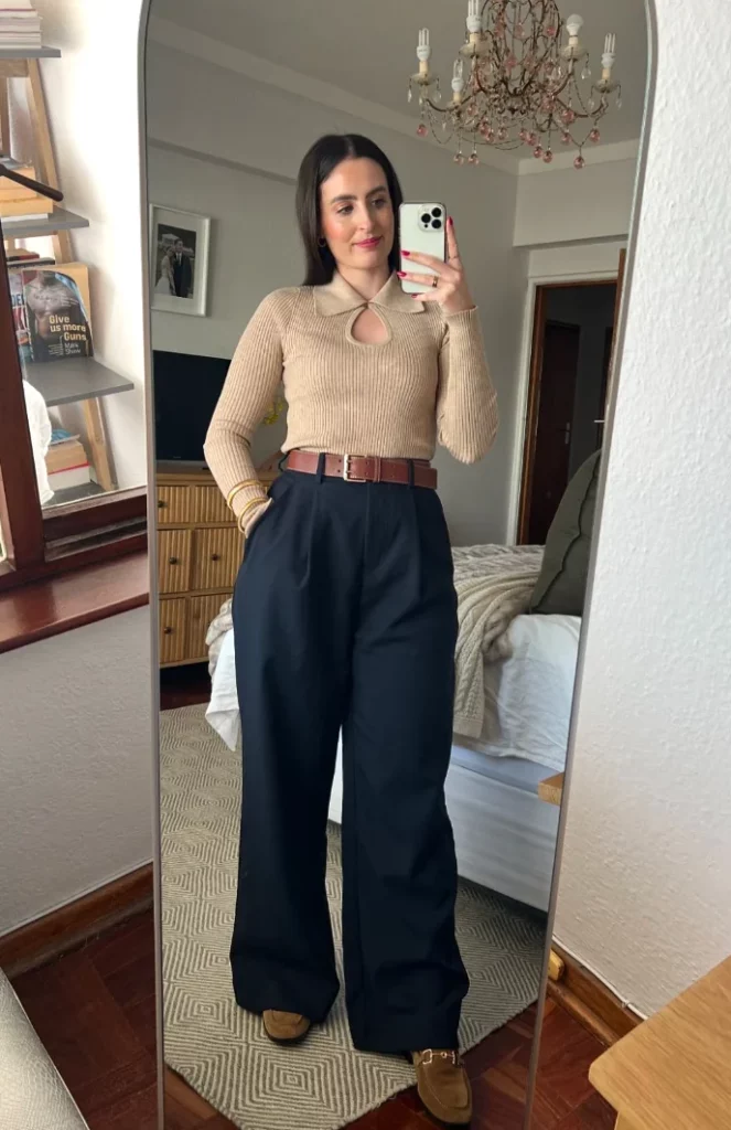 Beige Ribbed Keyhole Sweater + Navy Wide-Leg Trousers + Brown Leather Belt + Brown Loafers