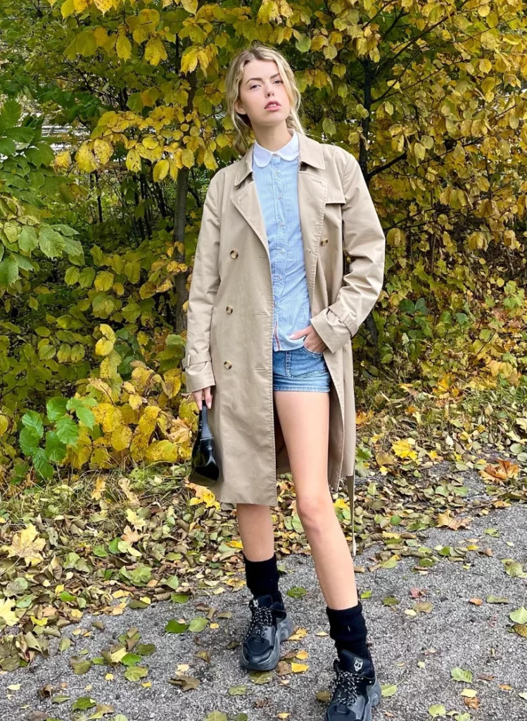 Beige Trench Coat + Blue Button-Up Shirt + Denim Micro Shorts + Black Sneakers