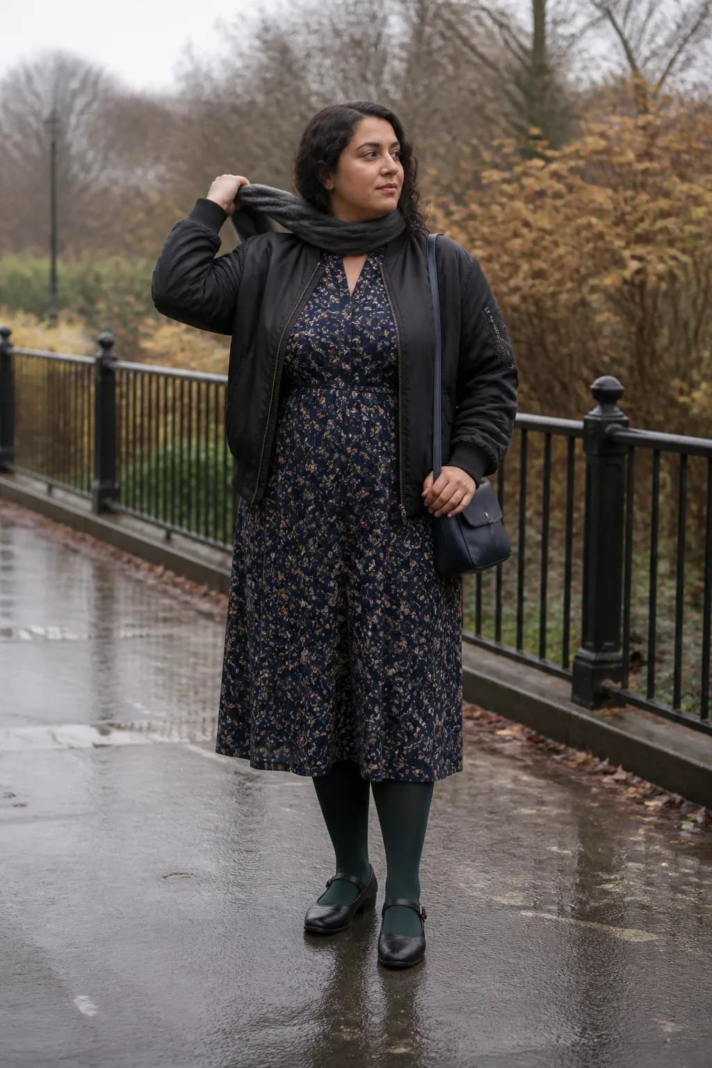 Black Bomber Jacket with a Floral Midi Dress