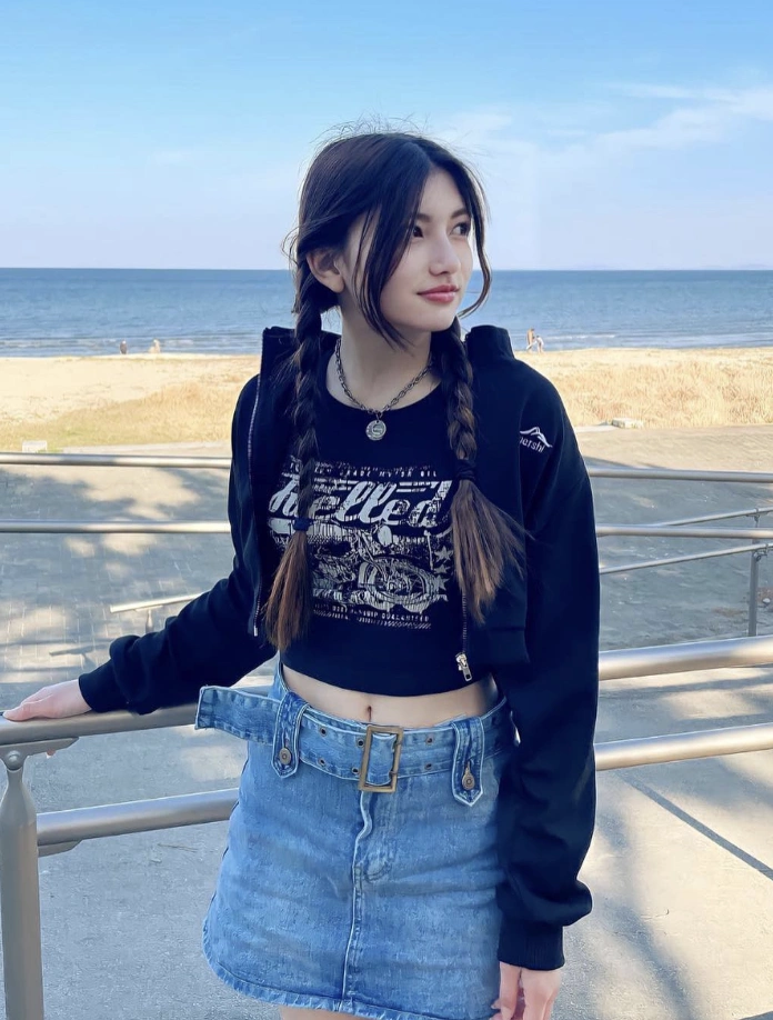 Black Cropped Zip-Up Hoodie + Black Graphic Print Crop Top + Light Wash Denim Mini Skirt + Silver Necklace