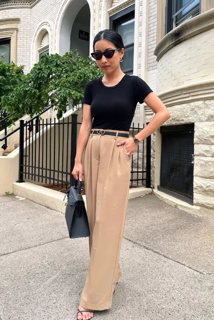 Black Fitted T-Shirt + Beige High-Waisted Wide-Leg Trousers + Black Belt + Black Strappy Heeled Sandals