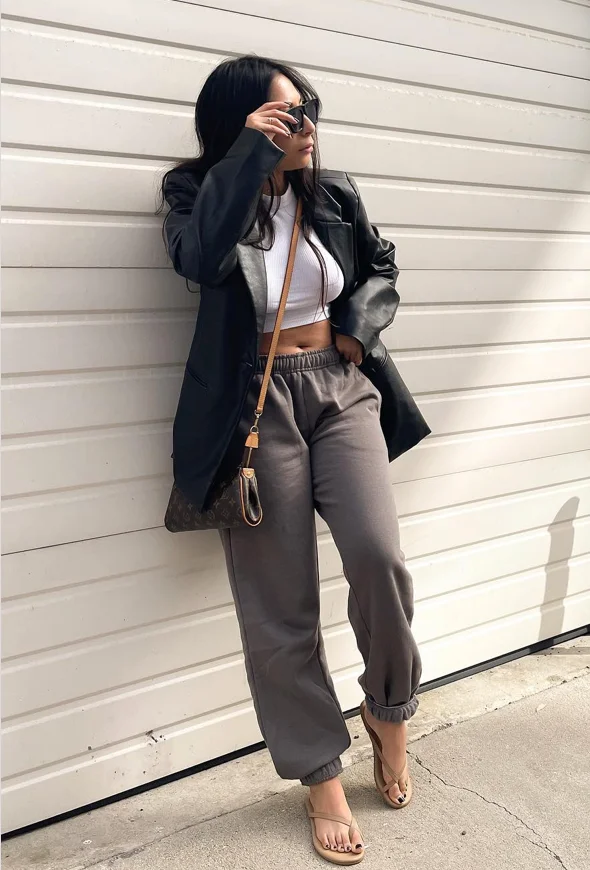Black Leather Blazer + White Cropped Tank Top + Gray Jogger Sweatpants + Tan Strappy Heeled Sandals