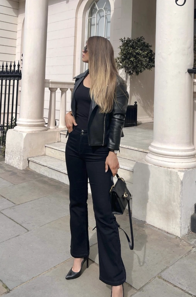 Black Leather Jacket + Black Tank Top + Black Flared Jeans + Black Pointed-Toe Heels