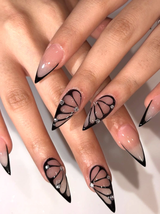Black Outline Stiletto Nails with Butterfly Accent