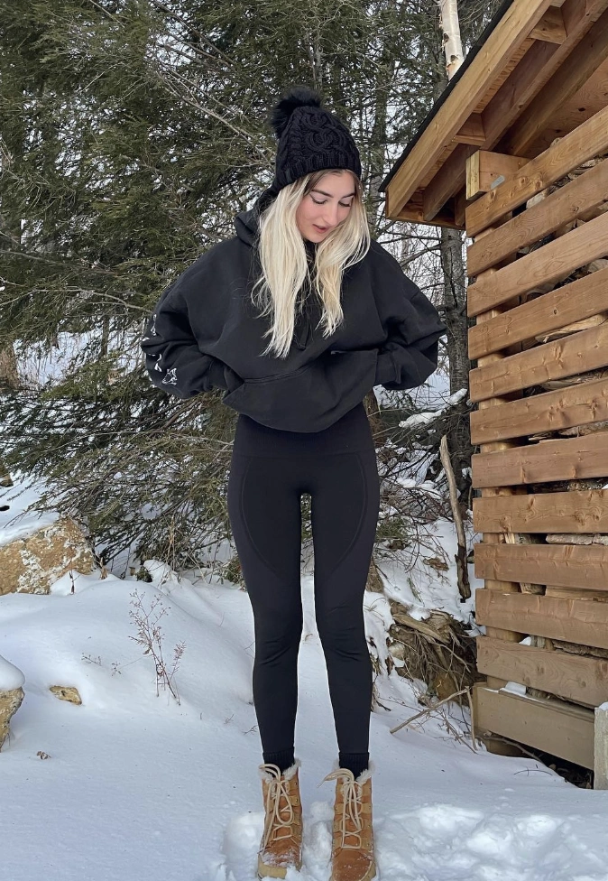 Black Pompom Beanie + Oversized Hoodie + Black Leggings + Winter Boots