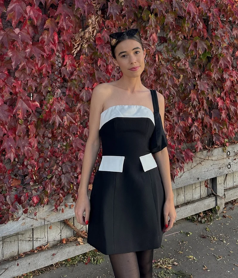 Black White Color Block One-Shoulder Mini Dress with Black Tights and Black Heeled Loafers