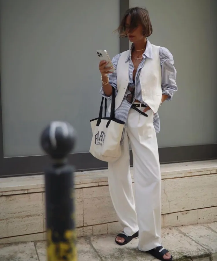 Blue Striped Button-Up Shirt + White Tailored Vest + White Wide-Leg Trousers + Black Slide Sandals