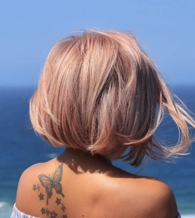 Blunt Bob with Soft, Tousled Texture and Dusty Rose Hair