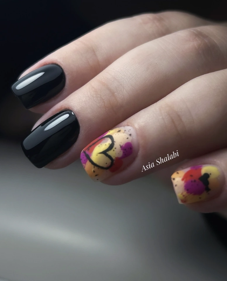 Bold Black Gloss and Abstract Heart Accent Nail Art