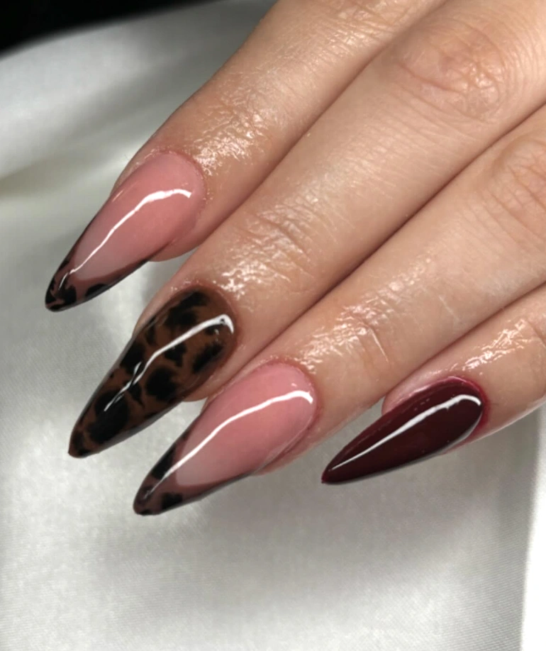 Bold Burgundy and Glossy Leopard Print Almond Nails with a Chic Edge
