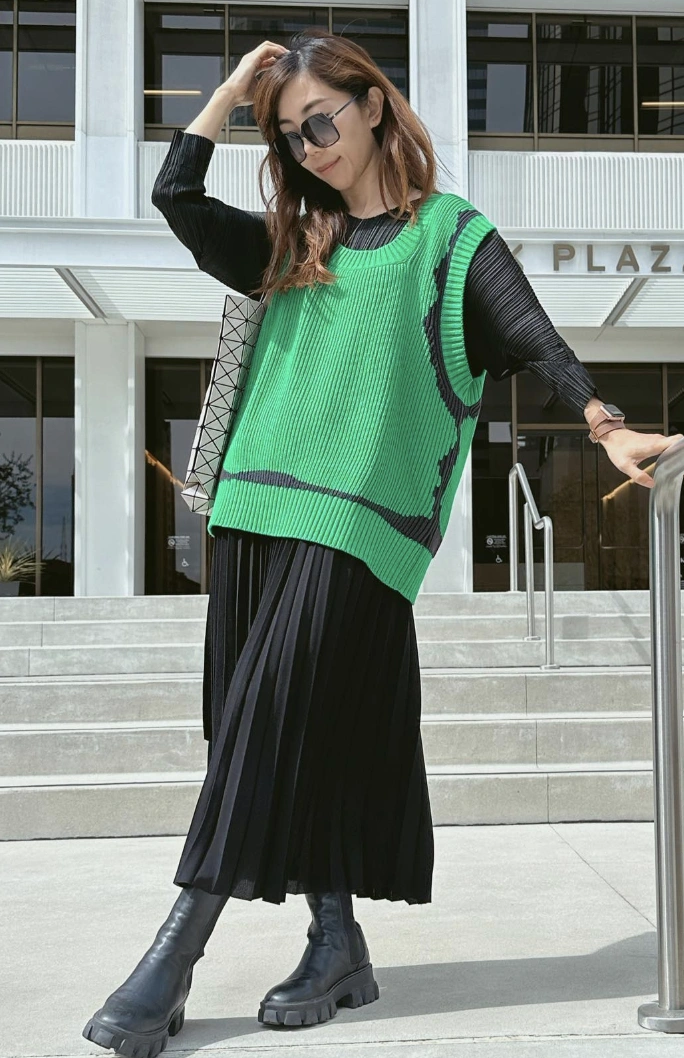 Bold Green Sweater Vest + Black Pleated Maxi Skirt + Chunky Black Ankle Boots