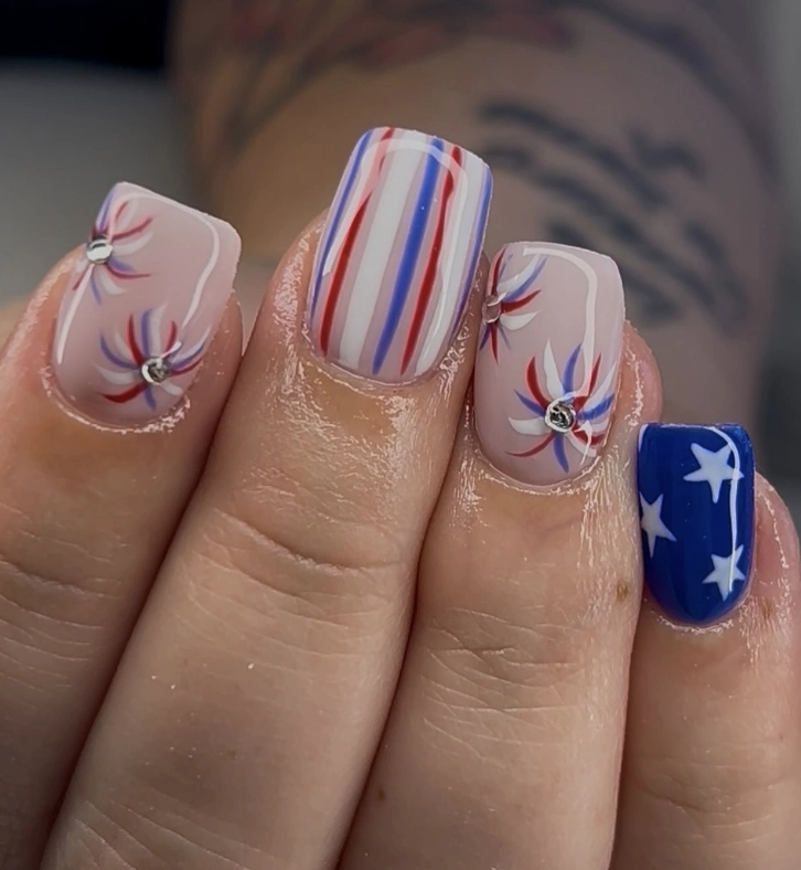 Bold Red, White, and Blue Square Nails with Firework Designs