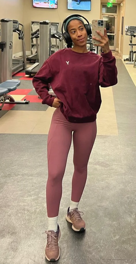 Burgundy Sweatshirt + Pink Leggings + Pink Running Shoes + White Crew Socks + Black Headphones