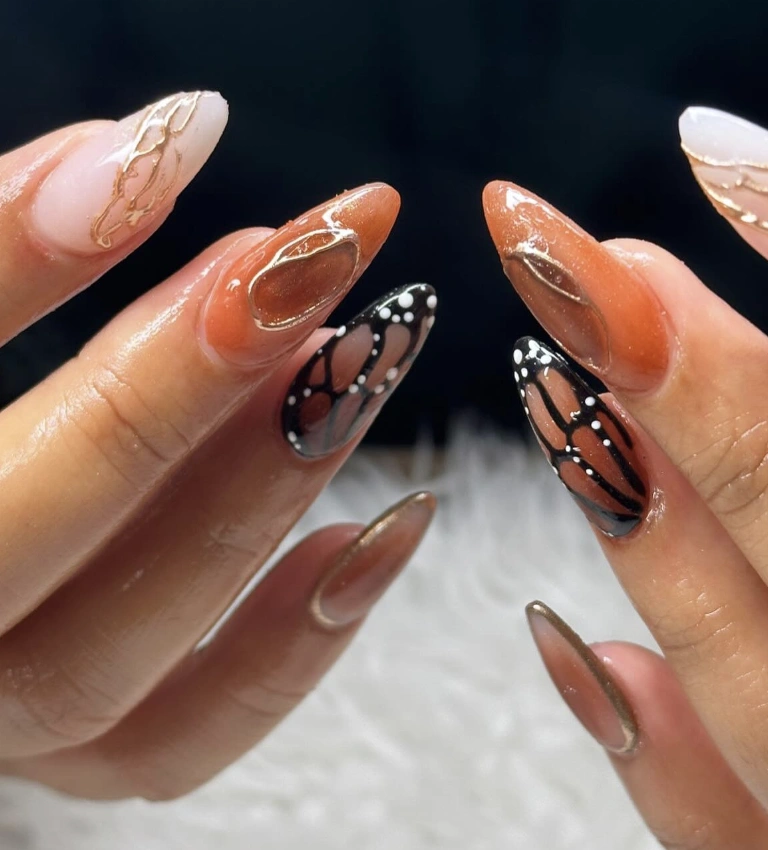 Butterfly-Inspired Short Almond Nails Fall with Warm Tones and Elegant Line Art