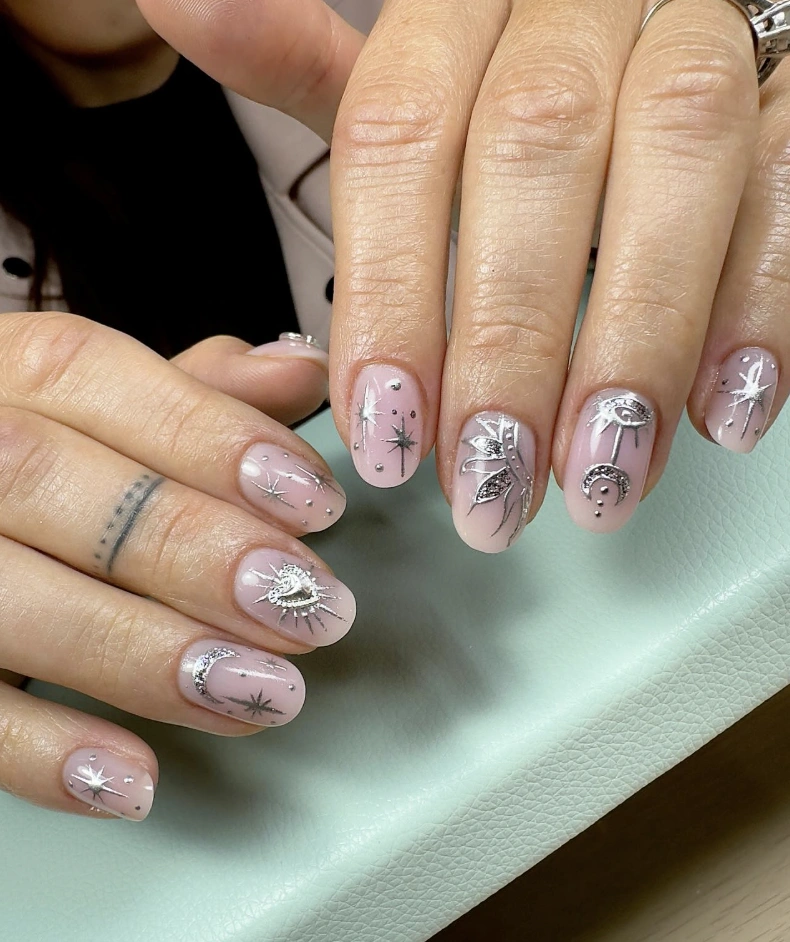 Celestial Charm: Milky Almond Nails with Silver Details