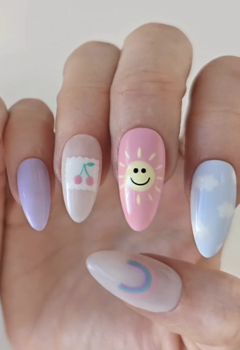 Charming Pastel Stiletto Nails with Whimsical Cloud Designs and Cheerful Sun Accents