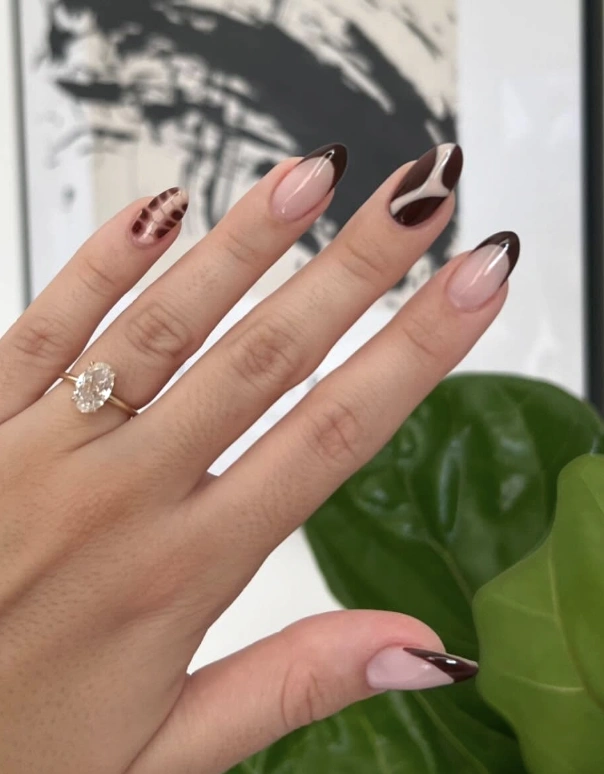 Chic Almond Gel Nails with Chocolate Brown Tips and Swirled Marble Design