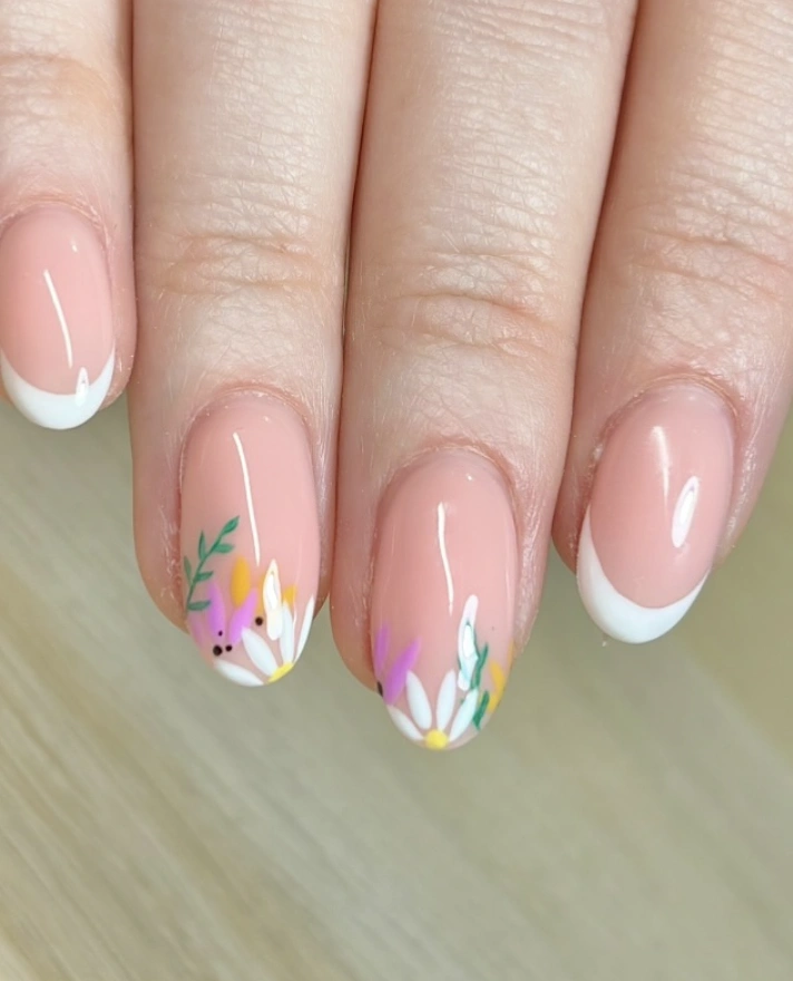 Classic French Manicure with Delicate Floral Accents