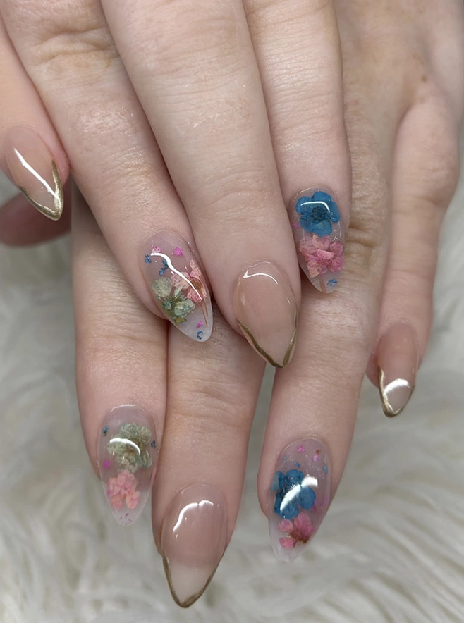 Clear Almond Nails with Pressed Flowers and Gold Outlines