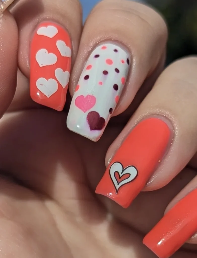 Coral and White Square Nails with Heart Motifs
