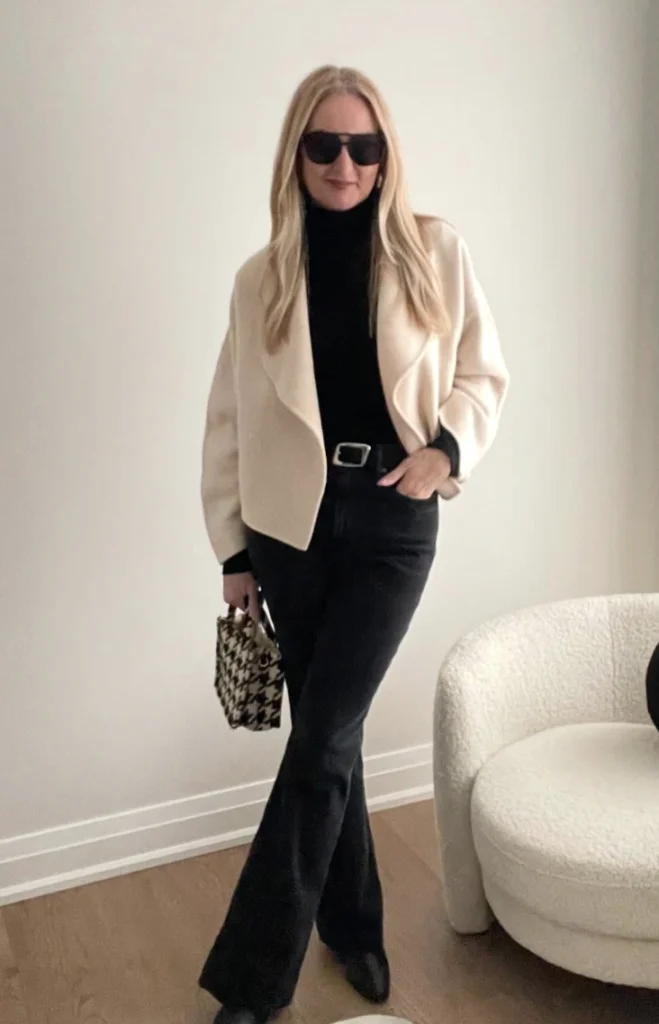 Cream Waterfall Jacket + Black Turtleneck Sweater + Black Flare Jeans + Black Ankle Boots