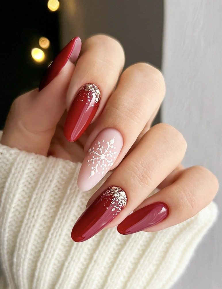 Crimson Almond Nails with Gold Glitter & Snowflake Detail