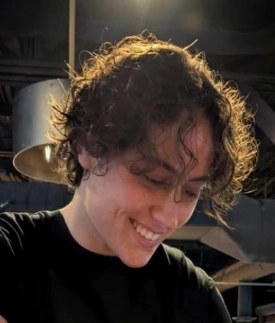 Curly Tomboy Haircut with Short Length and Soft Textured Layers