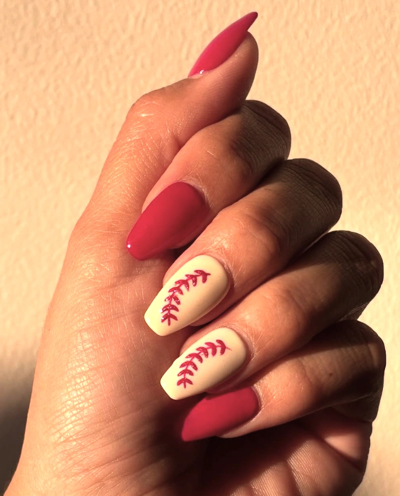 Cute Fall Nails with Almond Shape, Deep Red and Cream Colors, and Baseball Stitch Art