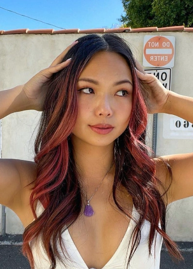 Dark Brunette Waves with Face-Framing Pink Blonde Hair Highlights