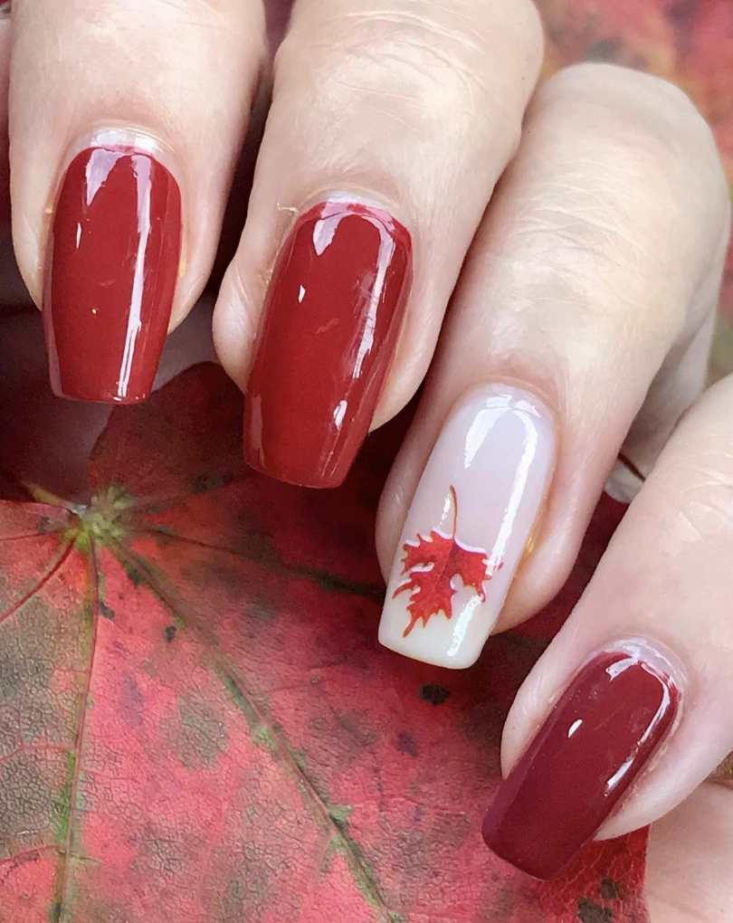 Deep Burgundy Square Nails with Autumn Leaf Art and Glossy Finish