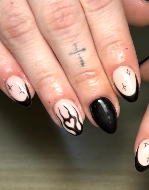 Edgy Almond Nails: Black French Tip Accents with Flame Detail